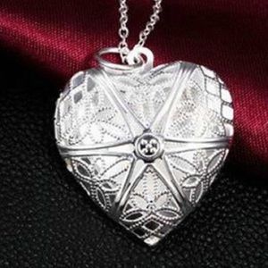 Silver open design locket necklace with black cord